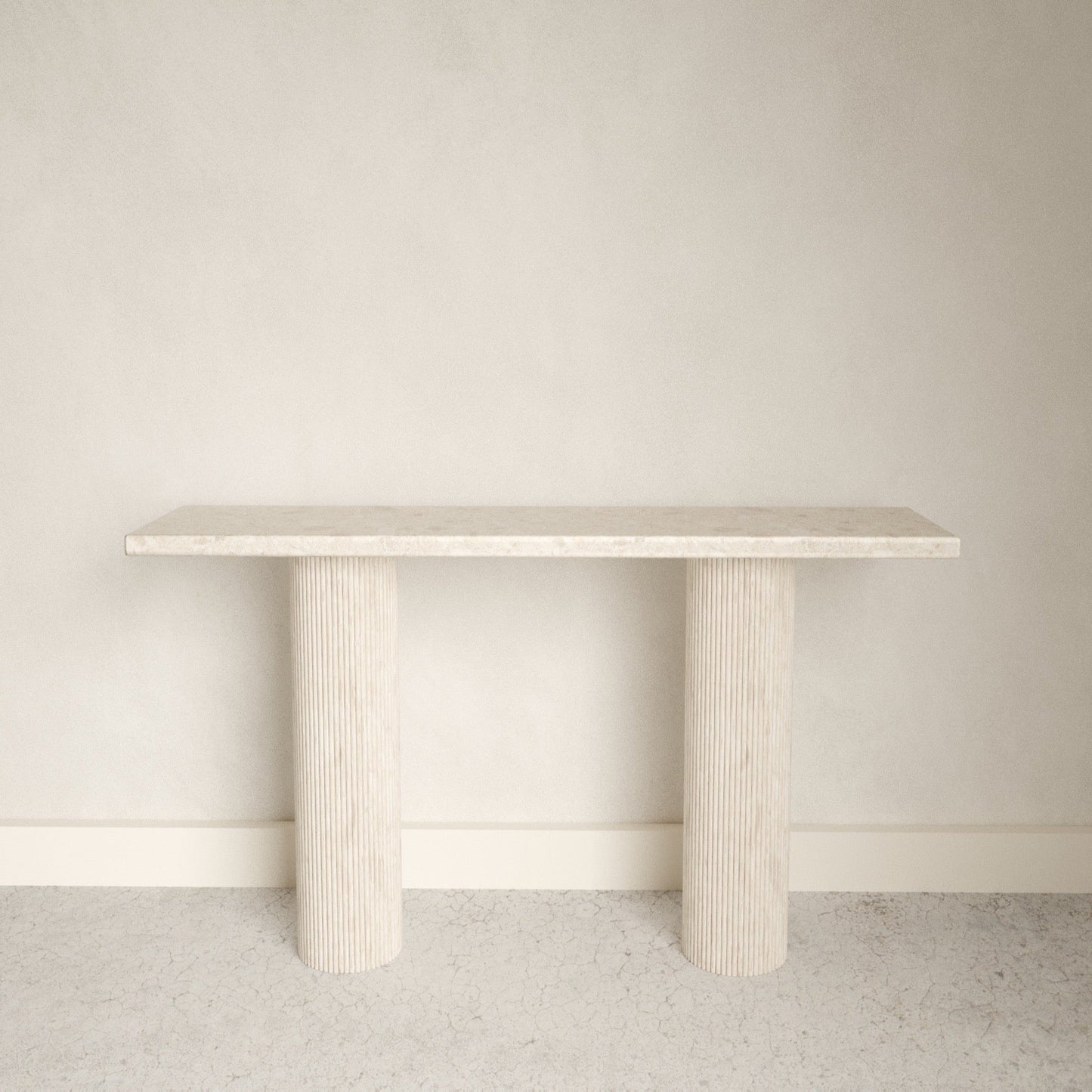 A smooth edged rectangular white Omani Marble marble console table with Roman style pillars.