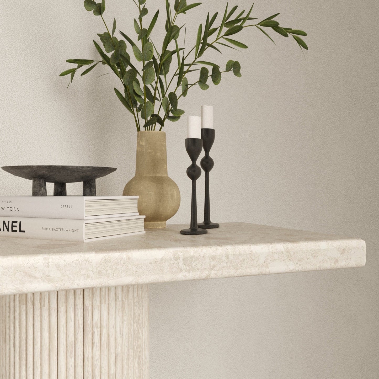 Close up of the Eternity Omani Marble Table, showcasing its smooth edges, texture and Roman pillar table legs.