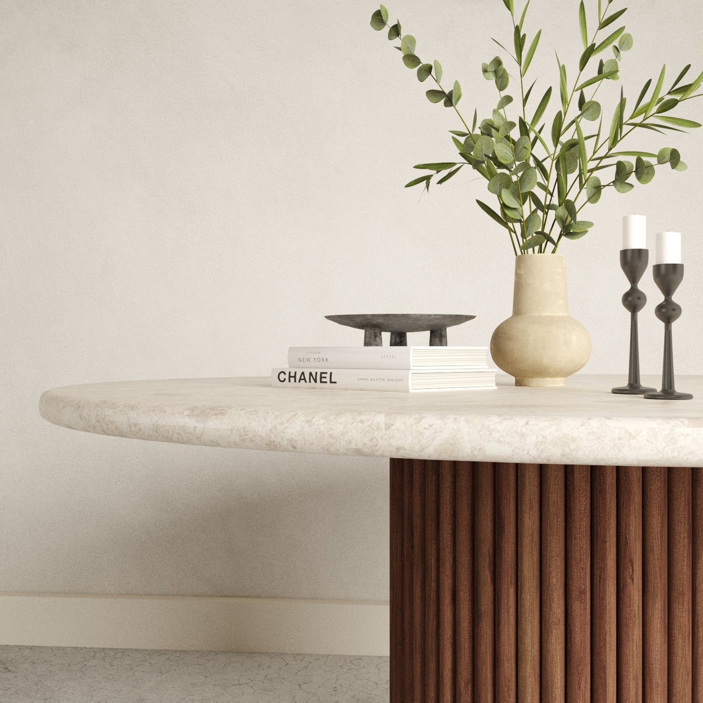 Close up of the rounded marble table top with wood foot base
