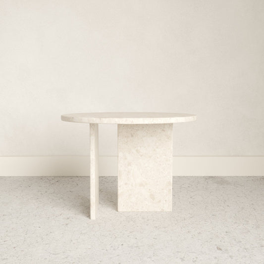 A beautiful round top marble side table with strong rectangular marble slab feet.