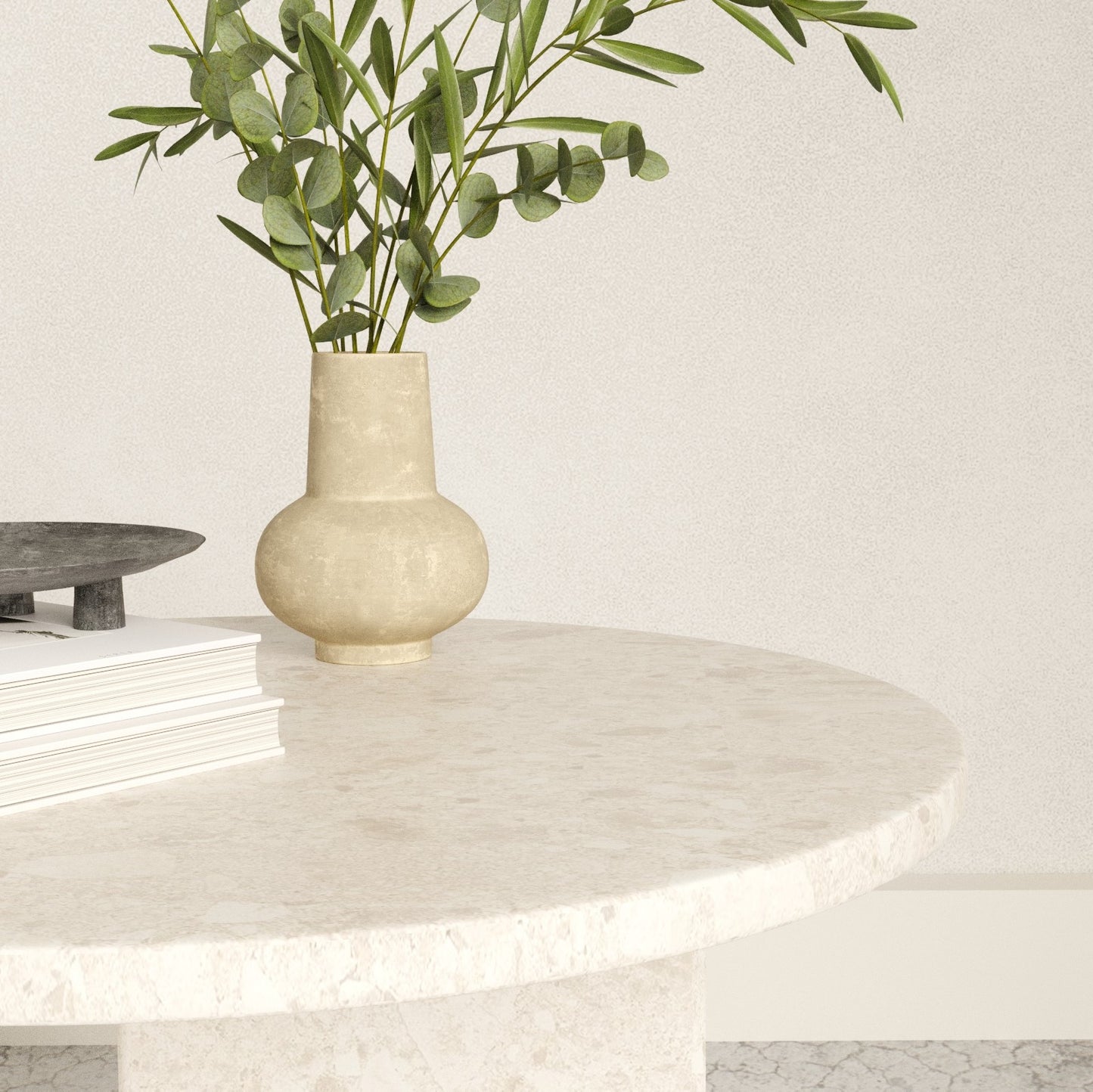 Close up of the round top marble side table with some table accessories