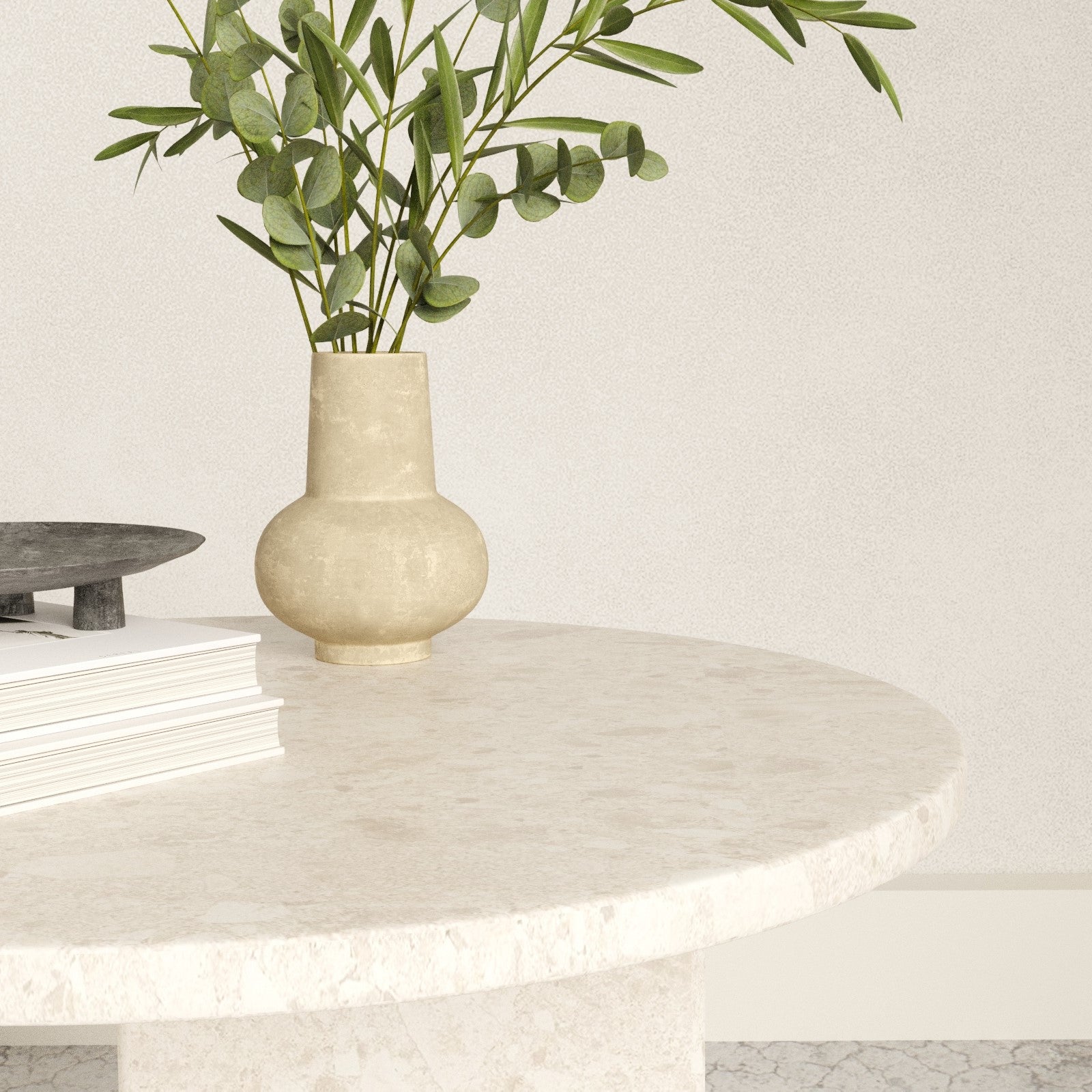 Close up of the round top marble side table with some table accessories