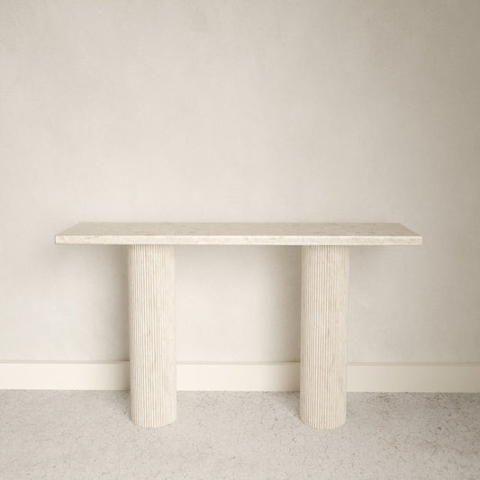 A smooth edged rectangular white Omani Marble marble console table with Roman style pillars.