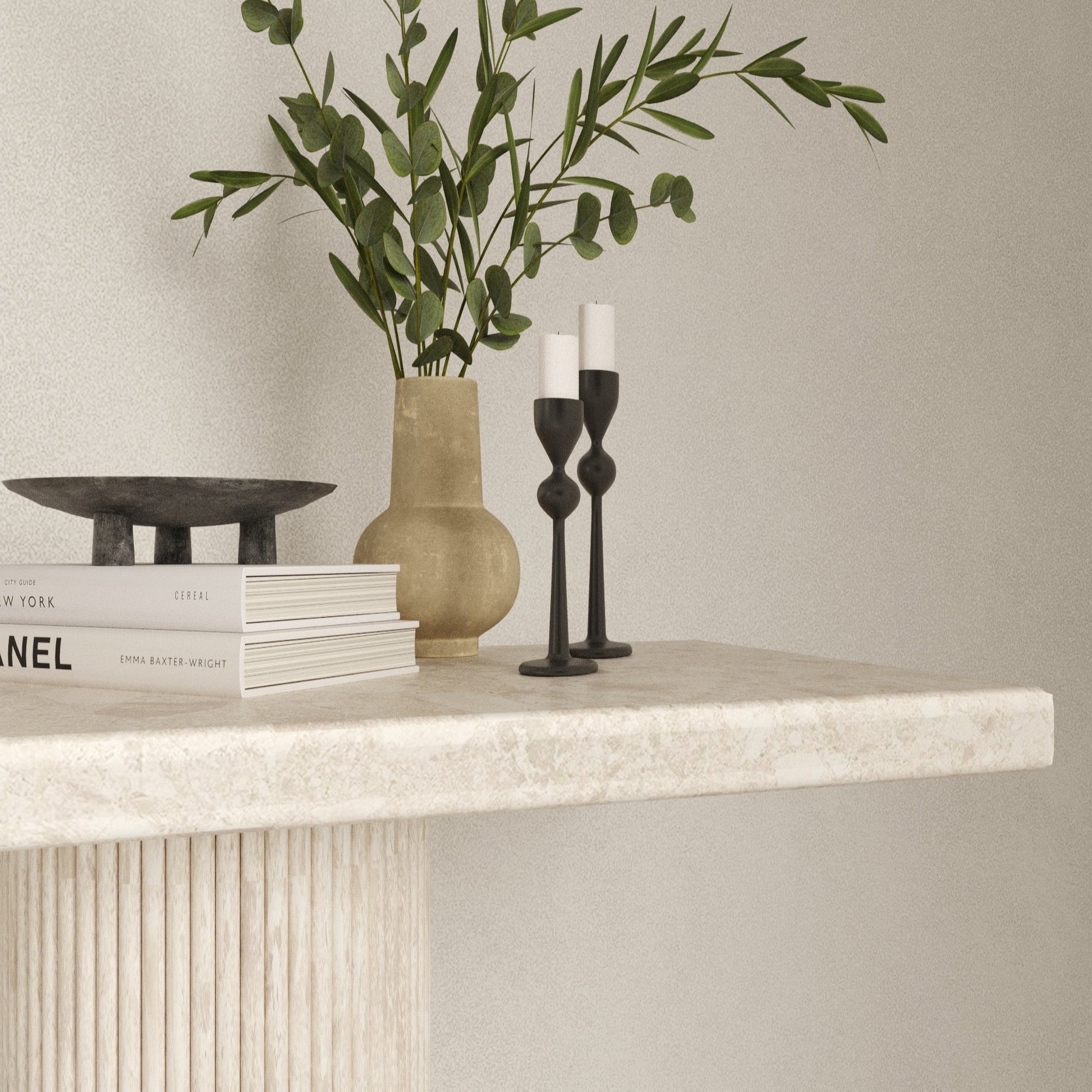 Close up of the Eternity Omani Marble Table, showcasing its smooth edges, texture and Roman pillar table legs.