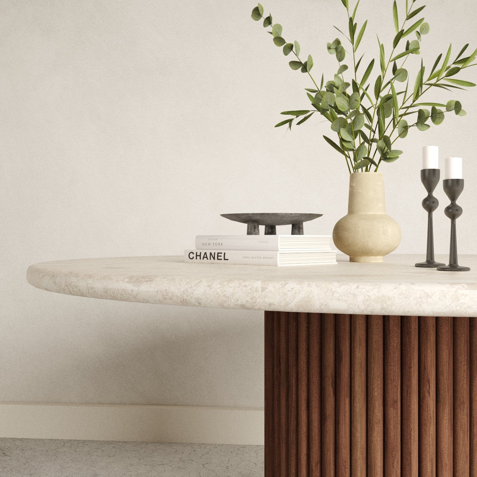Close up of the rounded marble table top with wood foot base